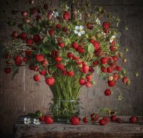 Конечно, талант. И очень часто - дополнительное образование. Чтобы человек понимал, что с чем сочетается и смог увидеть в ерунде сочетаемые цвета и вещи. Здесь даже не поможет и то, что фотограф супер-профессионал. Это выглядит, словно взяли и накидали всего - вы попробуйте. Увидите, что не получится с первого раза. Либо вы - талант :) 

Обожаю фотографии красивых натюрмортов и прекрасно понимаю, что талант не только сделать фото и хорошо его обработать, но и сделать "вкусную" композицию, чтобы цвета и предметы сочетались. Поверьте, это дело не 10 минут.