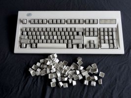 Найдите себе IBM-овскую старую клавиатуру :)
На работе такие были в комплекте с компами давно. 
Там были "накладные" клавиши, вытаскиваешь их и моешь любым удобным способом, мы кидали в горячую воду с стиральным порошком или мылом.