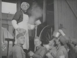 Из отечественного кино. Боевой киносборник №3 (22 августа 1941г.) Новелла "Антоша Рыбкин". 
Сюжет: Идёт Великая Отечественная война. Многих парней призывают на фронт. Среди них Антоша Рыбкин, колхозный повар. Антоша хочет попасть в разведку, о чём и просит на призывном участке. Военком же решает по-своему, он считает, что поварская специальность парня пригодится и на войне. Так Антоша становится фронтовым поваром, война же берёт своё, и довольно сноровистому парню приходится не только кухарить, но и воевать с нацистскими захватчиками. 
Роль Антоши Рыбкина исполнил Борис Чирков.