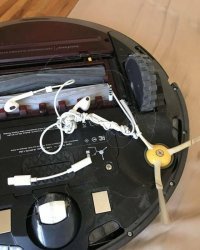 А тут что не так? Нефига раскидывать наушники и шнуры где попало, пылесос честно пытался выполнить свою работу!