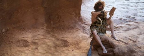 Ну, если иметь в виду просто человека, то можно смело миллион назвать  А если строго HOMO SAPIENS, то не менее 200 тысяч. 
Уже Homo erectus был "ГОЛЫМ", не говоря о Sapiens, т.е. ЛИШЕННЫМ ВОЛОСЯНОГО ПОКРОВА.
А поскольку стоянки и тех и других встречаются в самых разных местах, то он бы просто НЕ ВЫЖИЛ ФИЗИЧЕСКИ БЕЗ ОДЕЖДЫ. А под одеждой вполне можно подразумевать специально выкроенную и, возможно сшитую, ШКУРУ ЖИВОТНОГО.

PS А вы какое то селфи надеялись увидеть или какое поддтверждение, кроме здравого смысла?