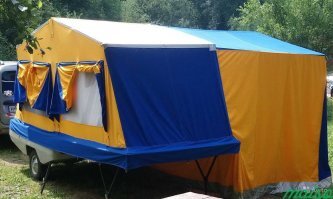 Наш, серийно выпускаемый в ссср, прицеп-полатка СКИФ М2, ничем не хуже.