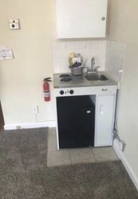 Это скорее всего для офиса. Огнетушитель и просьба или инструкция в районе выключателя. По-моему нормально.