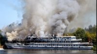 Здесь он лазил на Нижегородскую АС,которая так никогда и не была запущена.В ней  сдавали кому ни попадя площади в аренду, разливали водку,коптили рыбу и т.д и т.п.,сейчас её купил за три копейки какой то "пизнесмен",может после этого она стала засекреченной,если конечно обвиняют его по этому делу.
А это теплоход "Святая Русь",принадлежащий нынешнему владельцу АС.
.
Теплоход и ныне там стоит засирает затон.