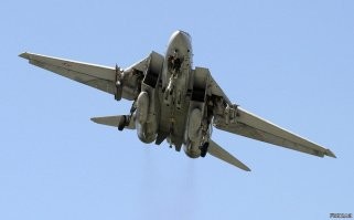 На первой фотографии МиГ-29, на второй F-14.