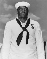 Дорис Миллер (англ. Doris Miller; 12 октября 1919, Уэйко, США   24 ноября 1943, Острова Гилберта и Эллис, Британские Западно-Тихоокеанские Территории)   американский моряк, участник Второй мировой войны, первый афроамериканец, получивший Военно-морской крест. 
Во время нападения на Пёрл-Харбор Миллер оказывал помощь умирающему капитану «Вирджинии», после чего встал за зенитную установку и вёл огонь, пока не кончился боекомплект. В ходе боя им был сбит один японский самолёт. После он присоединился к спасательной операции и вытащил из воды нескольких моряков[ ]. За эти действия он первым из чернокожих был награждён Военно-морским крестом.