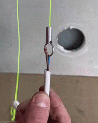 А что мешает пихнуть провод через верхнее отверстие, без всяких магнитов и веревок?