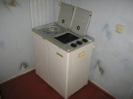 У меня в кладовке стояла, там заодно и все стояки рядом. С боковой загрузкой там не развернёшься... А до этого стояла машинка советская типа этой, но я её модернизировал, поставил на станину, подвёл воду холодную и горячую, а для слива сделал педаль снизу, сразу в канализацию. Вещь, полуавтомат блин