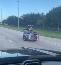 И что смешного автор тут увидел? Что инвалид может ездить на мотоцикле или перевозить жену инвалида?