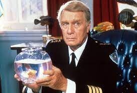 Джордж Гейнс. 
Родился 3 мая 1917 года в Гельсингфорсе, столице Великого княжества Финляндского (с 6 декабря 1917 года Хельсинки, столица Финляндии) в семье артистки, модельера и светской львицы Ии Григорьевны Ге, ставшей впоследствии известной как леди Абди, и голландского бизнесмена Геррита Йонгеянса . Внук известного актера Императорского Александринского театра Григория Григорьевича Ге.

Дядя Джорджа Гейнса, родной брат матери, актёр Грегори Гай (урождённый также Григорий Григорьевич Ге), родился в Санкт-Петербурге, но после революции 1917 года эмигрировал в США. По линии матери Джордж Гейнс   также родственник художника Николая Николаевича Ге.

Он исполнял роли на Бродвее. В бродвейских музыкальных комедиях 1940-х и 1950-х заслужил репутацию подлинного мастера этого жанра. Одна из лучших его ролей   в постановке «Чудесный город», музыкальной версии «Моя сестра Эйлин». В кинематографе дебютировал в середине 1950-годов, но поначалу ему доставались только эпизодические роли в телесериалах и фильмах. В начале 1980-годов стал получать всё больше значимых ролей, снялся в комедии «Тутси», а также во всех семи частях культового комедийного киносериала «Полицейская академия», где сыграл роль коменданта Эрика Лассарда.