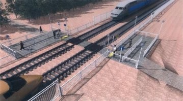 Ограду не поставили ещё.  Перед спуском и лестницей.
Для того, чтобы ненормальные не скатывались по горке через дорогу.
(Аналогично делают ж/д переход).