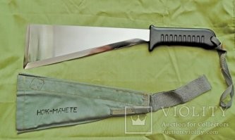 <<< съемный приклад, который мог использоваться в качестве мачете >>>

Точнее, наоборот: мачете могло использоваться в качестве приклада, для этого изменили конструкцию рукояти и чехла - добавили защелку и металлический затыльник. У ножа-мачете из НАЗ-7 рукоять резиновая, с отверстием для шнура-фиксатора.
Кстати, металл назовского лезвия весьма унылый.
