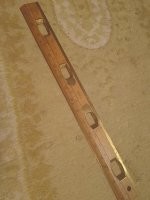 Латунная линейка с вырезами напоминает мне один из вариантов линейки Дробышева, применяемой для нанесения координатной сетки на ватманскую и ли лавсановую основу в геодезии и картографии.