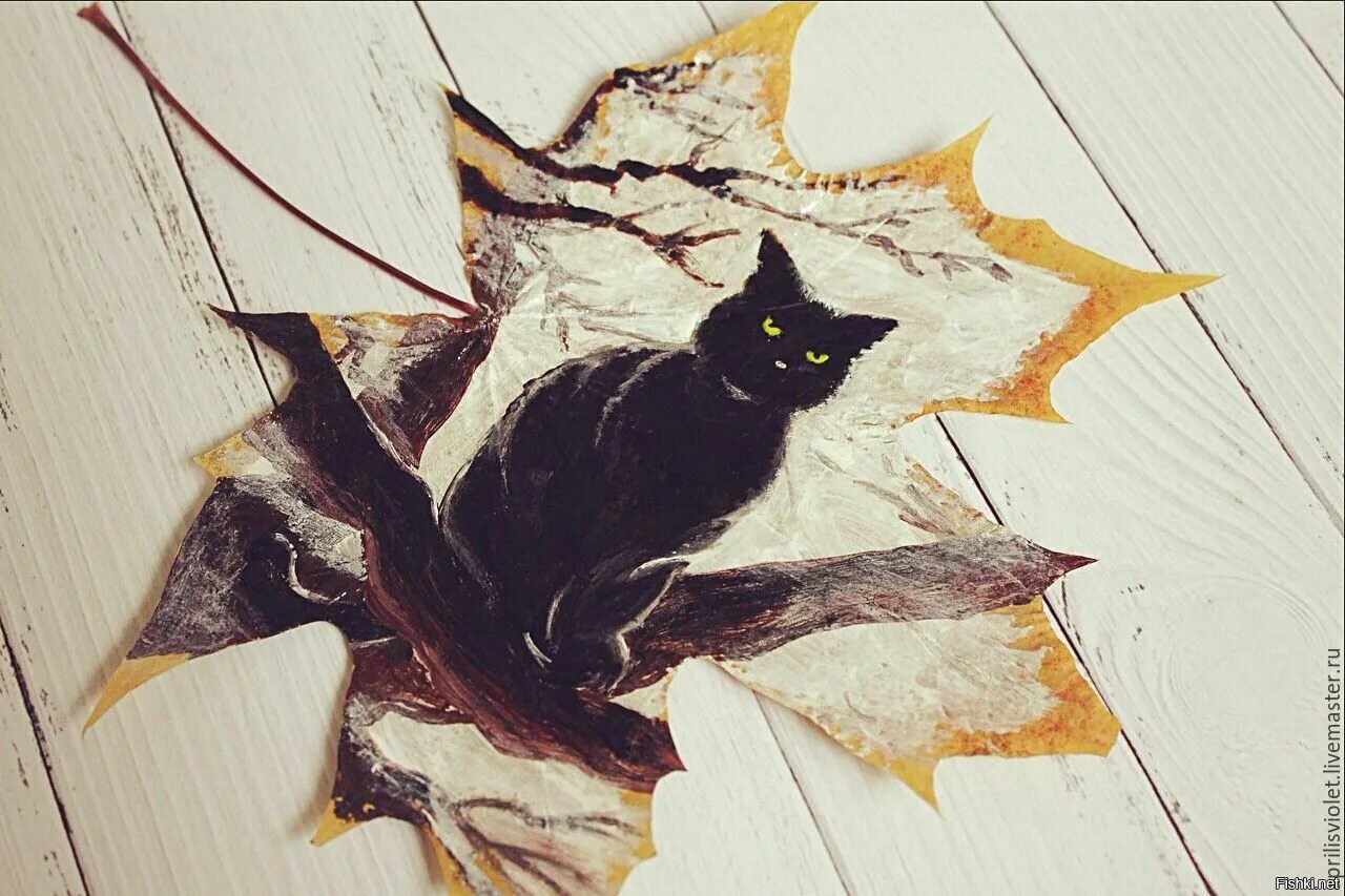 Картина из листьев кот