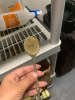 Это не нож для писем, а ложечка для употребления абсента.