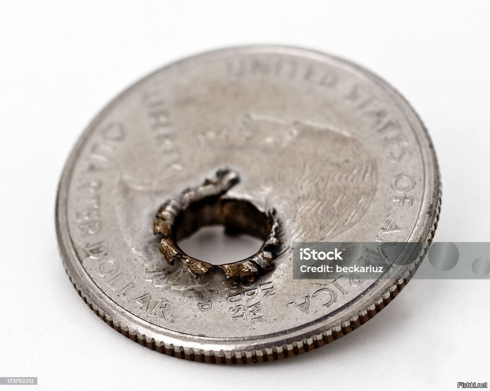 Вот как выглядит монета с отверстием от пули. А всё остальное - подделка.