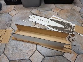 18. "Контейнер для носков в виде Falcon 9 с драконом и Доге на борту"
Ну и перевод...
Дракон - это Dragon,  точнее здесь Crew Dragon, космический корабль СпейсИкс.  А Доге - это мем, собака.