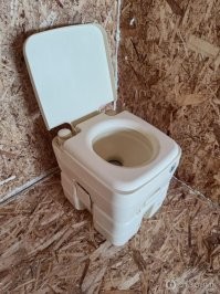 Биотуалет бы купили. Стоит не дорого, опорожнять кассету надо раз в 4-5 дней, и это гораздо эстетичнее, чем выкидывать мешочек с экскрементами.