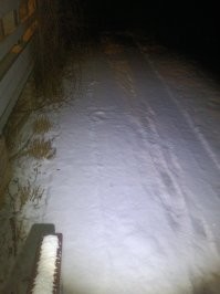 Э... Какие тени? Какое солнце? Пасмурно было. 

Вот, сходил, сфотографировал. 
Сейчас снега больше, но всё равно видно. 
Несколько дней мороз под минус десять градусов. 

Фонариком подсвечивал.