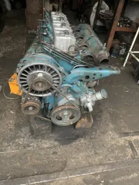 Судя по виду вентилятора - там воздушное охлаждение. Похожий двигатель стоял на тракторе Т-40