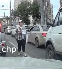 Может и не попрошайка, а кого-то разыскивает, на бумаге там какое-то фото