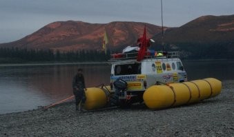 Ну ездишь ты по офигенно тонкому льду. 
Ну приделай пару поплавков. 
Пусть не таких больших, но могущих удержать до  эвакуации пассажиров. 

Да хоть пару брёвен поперёк машины, к бамперам, привяжи. 
Всё дольше проваливаться будет. 
А то и вообще, на поверхности останется.