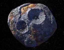Астероид Психея-16, расположенный в поясе астероидов между Марсом и Юпитером.  Этот небесный объект  только ПРЕДПОЛОЖИТЕЛЬНО содержит огромные запасы золота, платины, железа и никеля. 
А может и нет там ни хрена...

Картинка на тему Психеи-16.  Это не реальное фото, а лишь представление художника об астероиде...