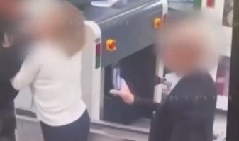 Этот-то, с телефоном, куда лез? 

Откуда-то у людей появилось твёрдое убеждение, что если он снимает на смартфон видео, то с ним ничего не случится. 

Это же аэропорт, там и так камер дофига.