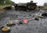 Ammunition and mines lie near a destroyed vehicle just outside Slaviansk. GLEB GARANICH/REUTERS