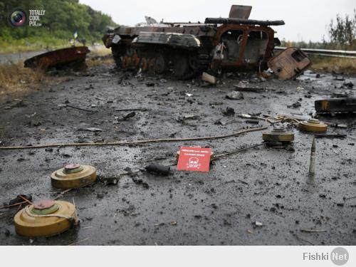 Ammunition and mines lie near a destroyed vehicle just outside Slaviansk. GLEB GARANICH/REUTERS