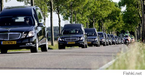 The convoy of hearses carrying coffins containing the remains of victims of the downed Malaysia Airlines flight MH17 drive near Hilversum after leaving the Eindhoven Airbase to Hilversum on July 23, 2014