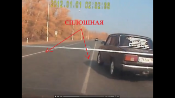 Для особо одарённых в месте поворота ВАЗа и обгона регом ДВЕ (не двойная) сплошные. Прерывистая начинается только на 50-ой секунде. 
Судя по всему ВАЗовод собирался заскочить на заправку. Так вот, также для особо одаренных, в районе выезда и въезда на АЗС стоят знаки "Движение только прямо"!
ВАЗ и рег - от 4 до 6 за выезд на встречку, плюс регу виновность в столкновении - в данной ситуации он ОБЯЗАН был затормозить, а не пытаться объехать по встречке.