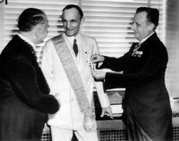 Henry Ford receiving the Grand Cross of the German Eagle from Nazi officials. 1938