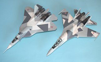 Так только моделист и разглядит: обычный читатель так глянет, а у нашего брата уже глаза на столько замылены, что против своей воли все видишь:))
Про косяки производителей вообще молчи! Иногда кааак влюбишься в какой-нить танк/самолет, а его только один производитель выпускает и тот какой-нибудь Милитарифилс: посмотришь в коробку и аж любовь вся проходит))) С другой стороны косячные модели не дают нам расслабитсья А то в век 3д принтеров скоро вообще ничего не надо будет делать: клей и краску в коробку налил, потряс и достал модельку)))
А Су-35 какой хотите собрать? Если модель от Звезды (который на коробке желто-зелено-коричневый), то я вас прям настоятельно отговариваю! Там в коробке лежат откровенно дрова старинной фирмы Накотне. Лучше взять новый Су-27СМ (именно такой, как на первой картинке) и покрасить его просто по фото. Там правда модель будет без маленьких передних крылешек (пго), но Су-35 сейчас строят именно без них!(второе фото - мой самый любимый окрас из всего семейства Фланкеров). Только с цифрами бортового номера будет проблема, но зато смотрите как они классно с Т-50(ПакФа) смотрятся!!!